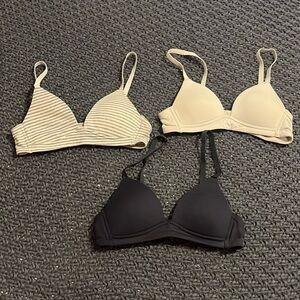 Navy blue, white, and striped bras in size 30A